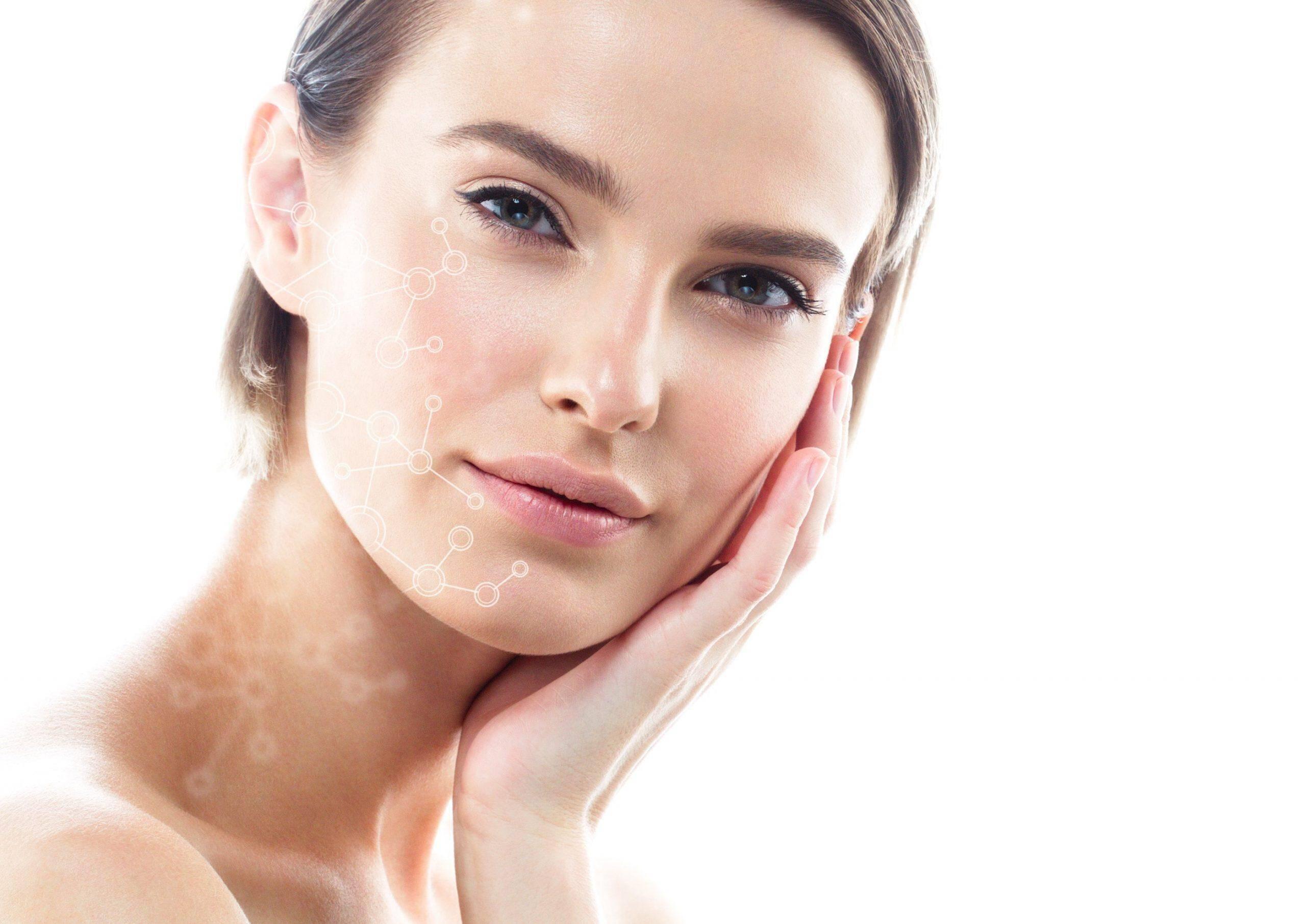 A woman with clear skin gently touches her face, looking at the camera. Transparent molecular structure graphics overlay one side of her face, suggesting skincare or beauty science. The background is white and bright.